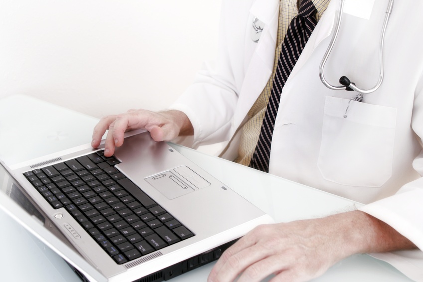 Doctor sitting at laptop
